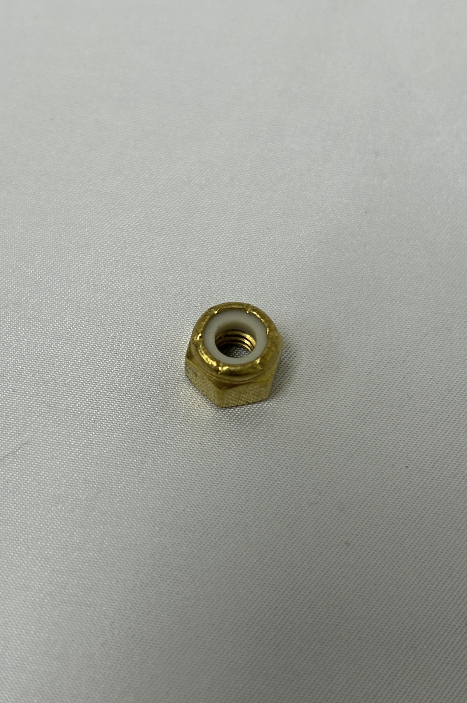 NUT/1/4-20,NYLOC,BRS